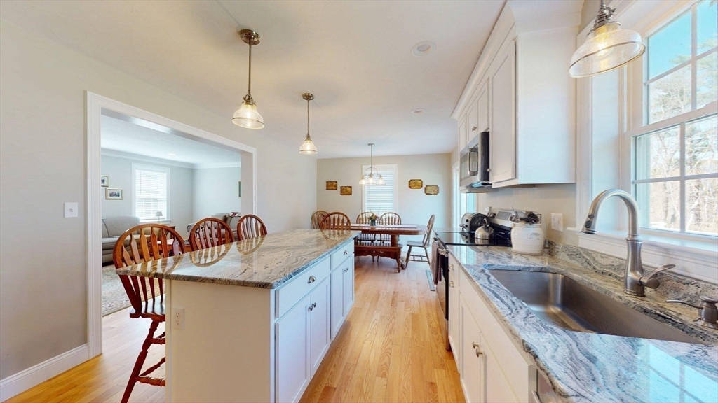 287 Wareham Street Middleboro, MA 02346 - Photo 3 of 28 a kitchen with granite countertop a sink a counter space appliances and cabinets