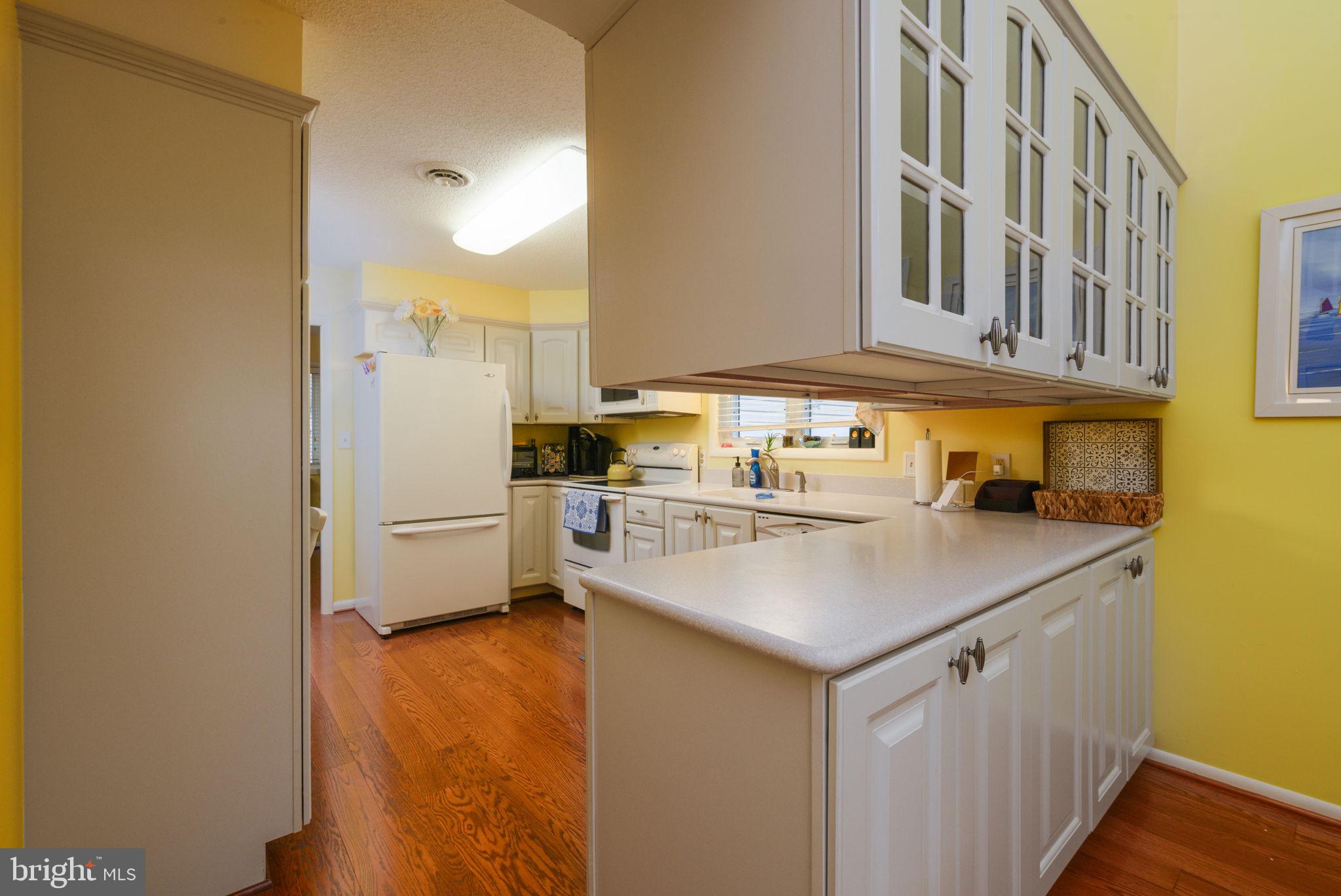 10 Gloucester Road Ocean Pines, MD 21811 - Photo 13 of 37 a kitchen with a sink a stove and a refrigerator