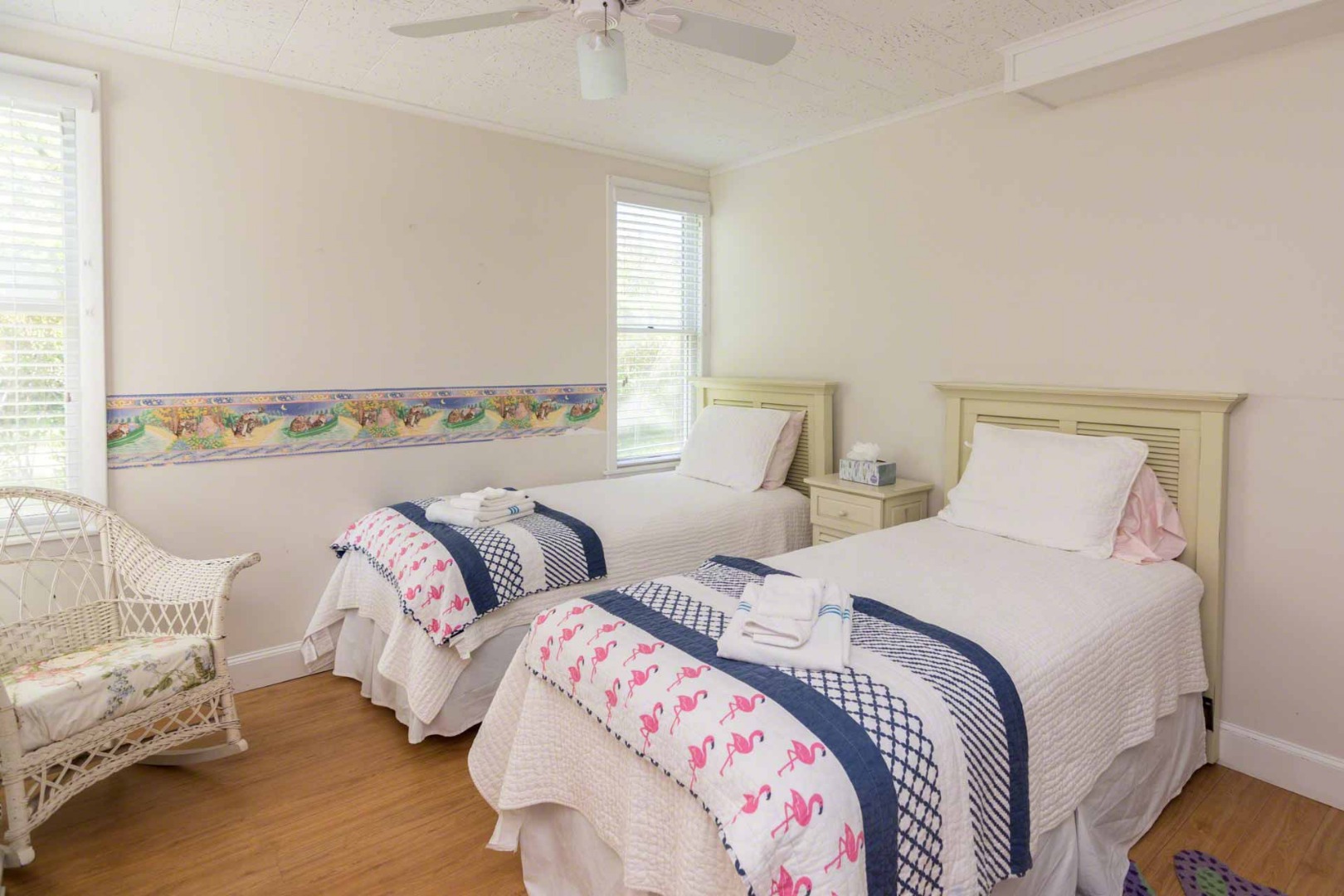 24 Manaca Hill Road Edgartown, MA 02539 - Photo 18 of 34 a bedroom with two beds and a chandelier