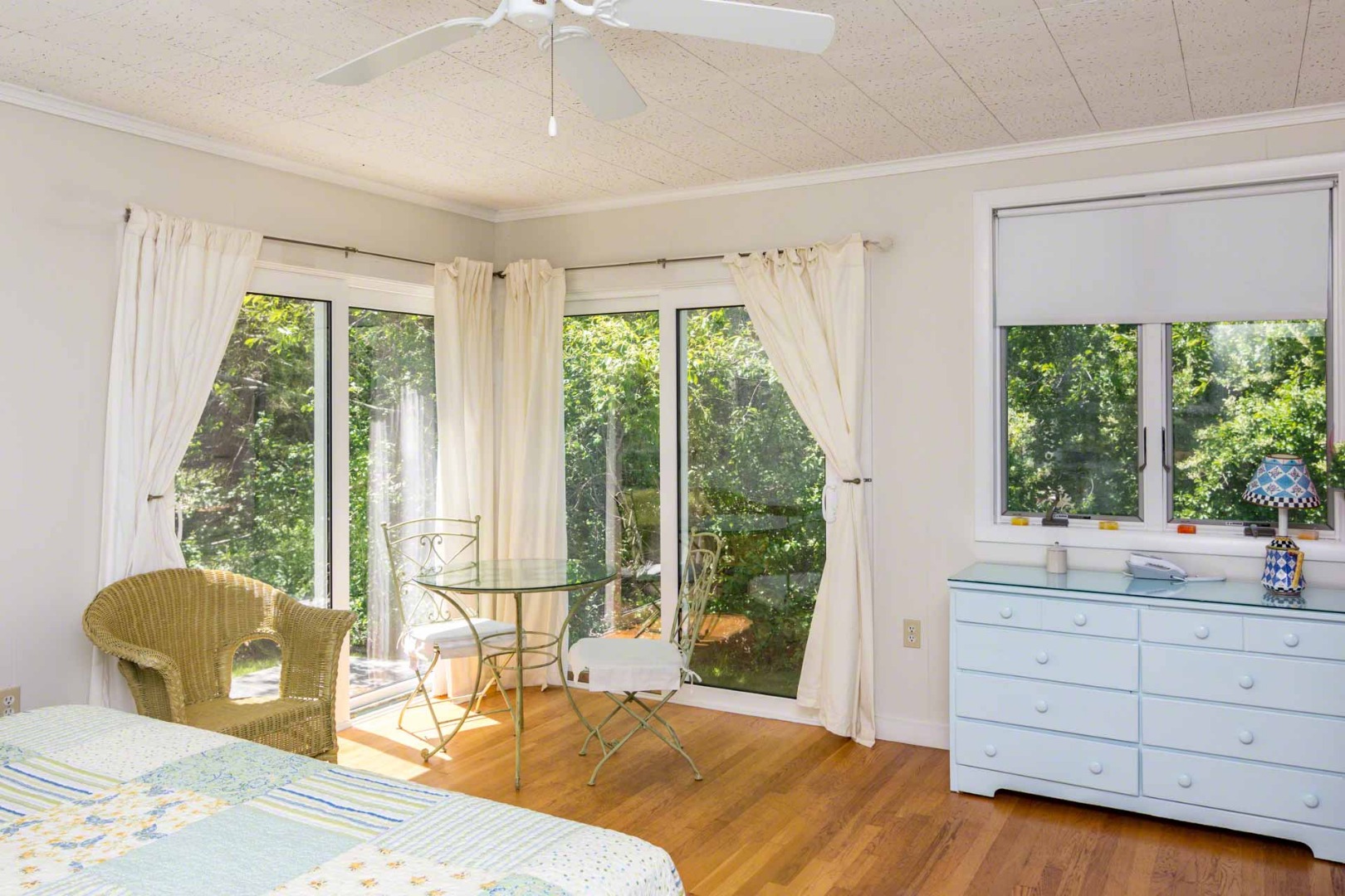 24 Manaca Hill Road Edgartown, MA 02539 - Photo 24 of 34 a bedroom with a bed and large windows