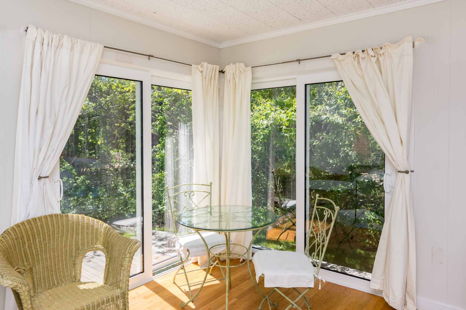 24 Manaca Hill Road Edgartown, MA 02539 - Photo 26 of 34 a view of a living room with furniture and floor to ceiling windows