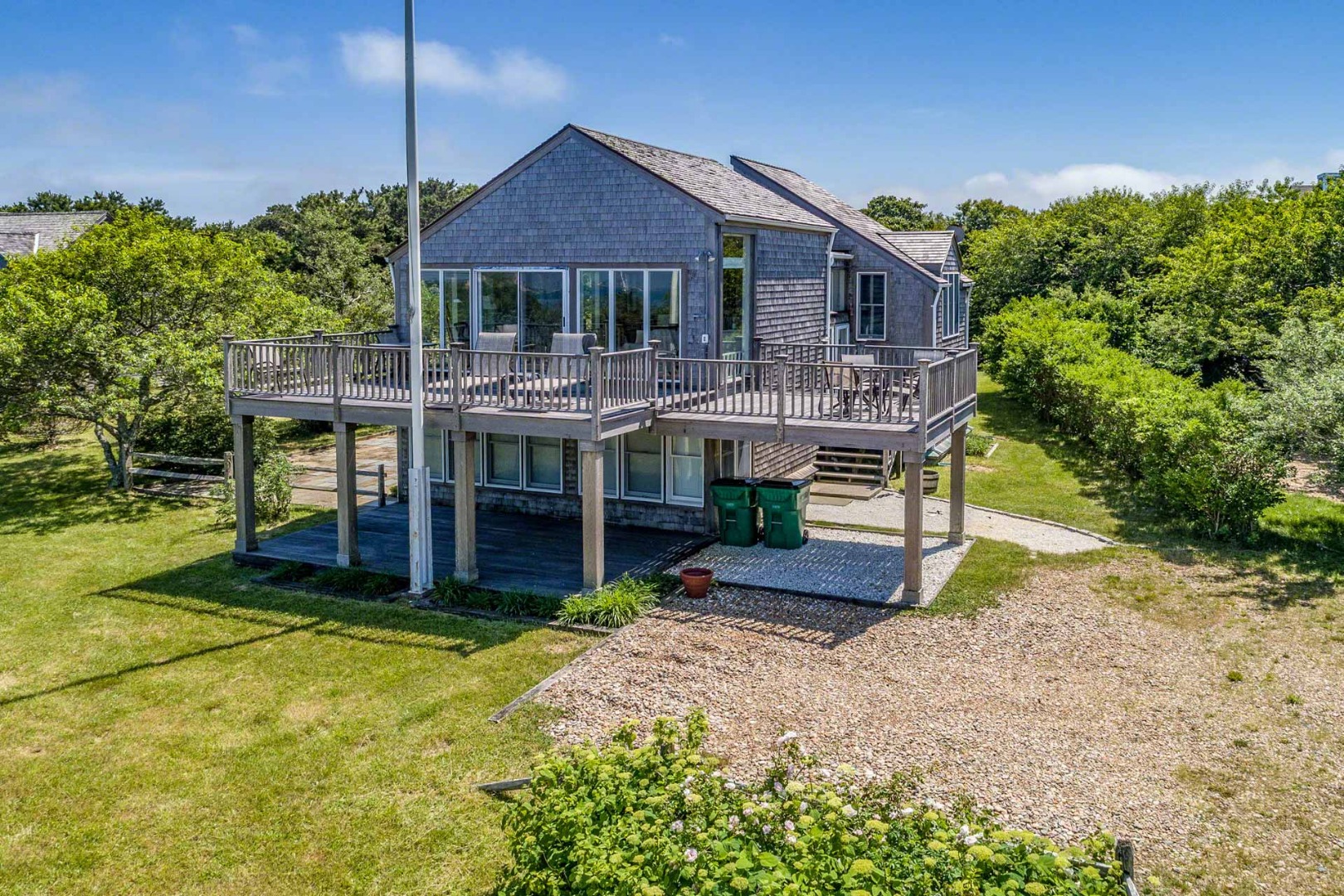 24 Manaca Hill Road Edgartown, MA 02539 - Photo 34 of 34 a front view of house with yard and green space
