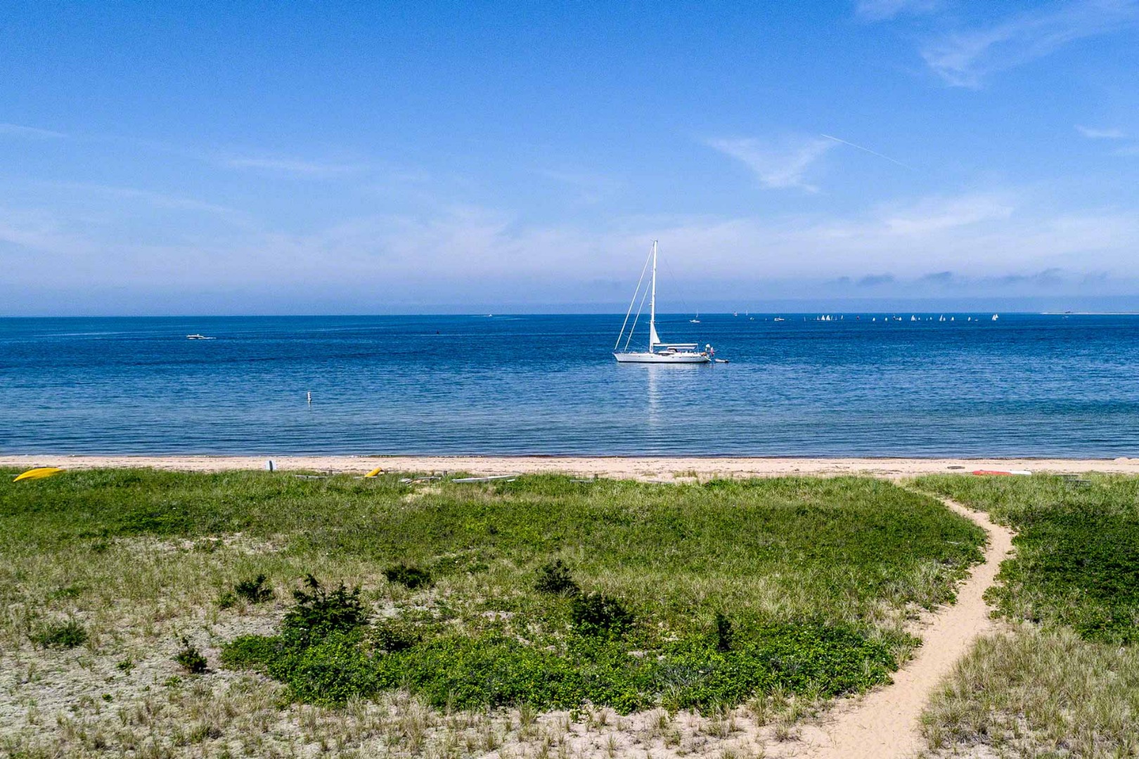 24 Manaca Hill Road Edgartown, MA 02539 - Photo 4 of 34 a view of a swimming pool with an outdoor space and seating area