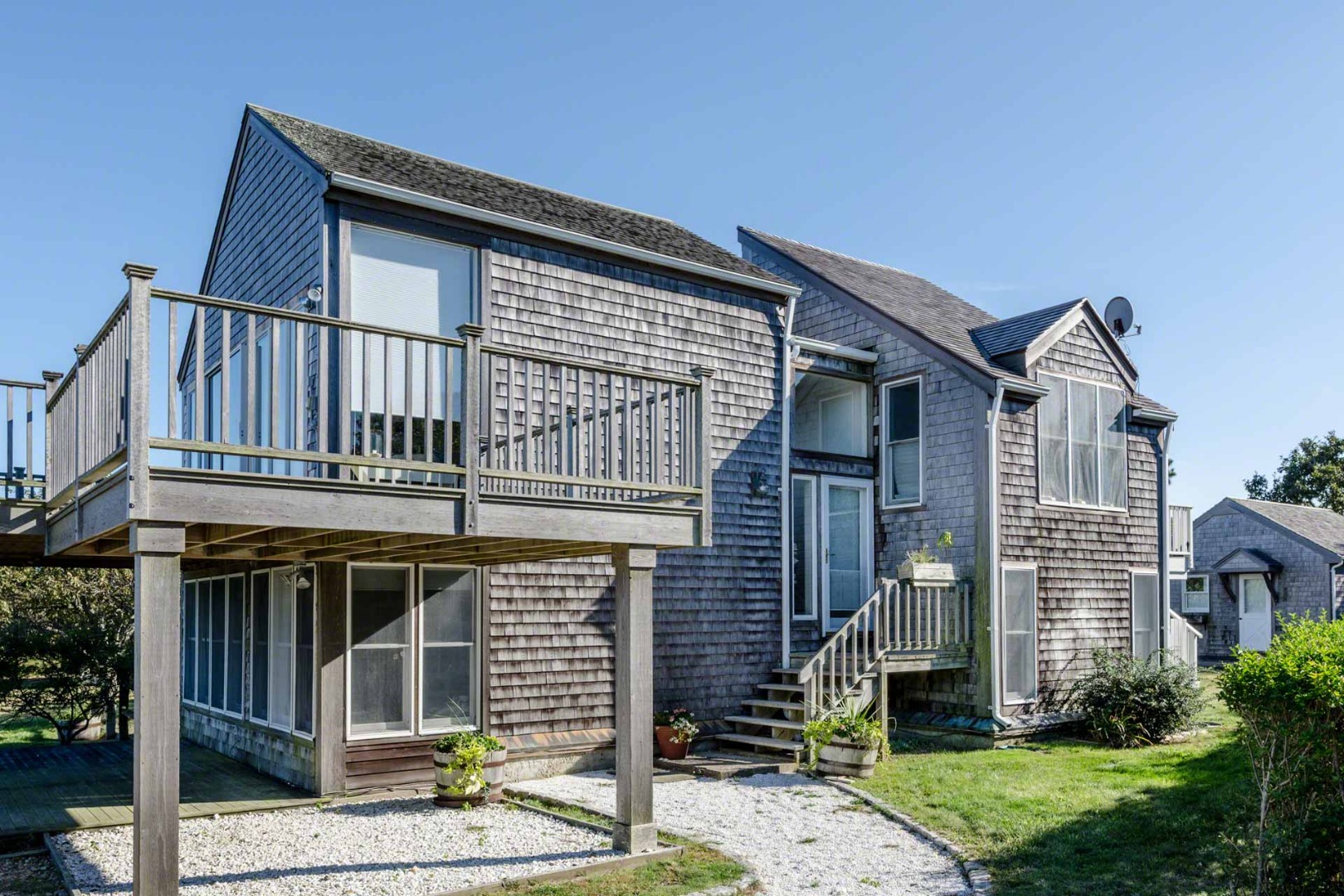 24 Manaca Hill Road Edgartown, MA 02539 - Photo 7 of 34 a front view of a house with garden