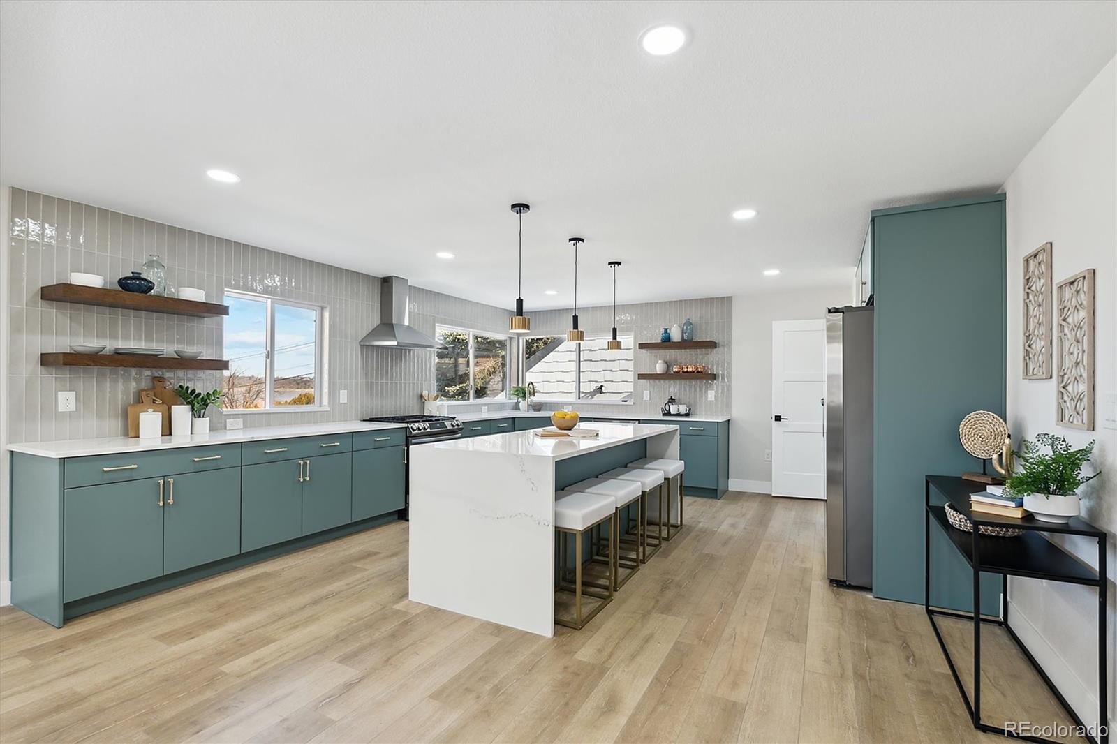 a kitchen with stainless steel appliances kitchen island wooden cabinets and center island