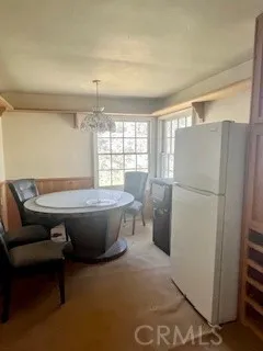 a room with pool table and windows