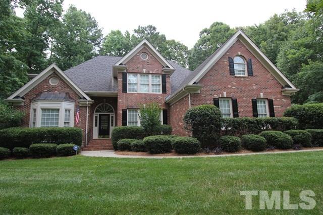 7121 Trenton Ridge Court Raleigh, NC 27613 - Photo 1 of 25 a front view of a house with a yard