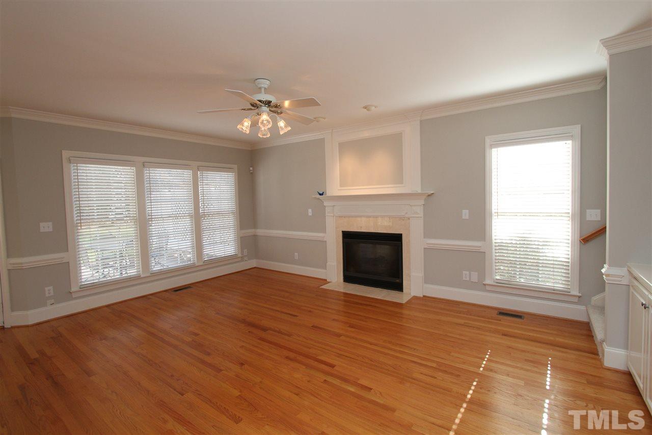 7121 Trenton Ridge Court Raleigh, NC 27613 - Photo 14 of 25 a view of empty room with wooden floor and fan