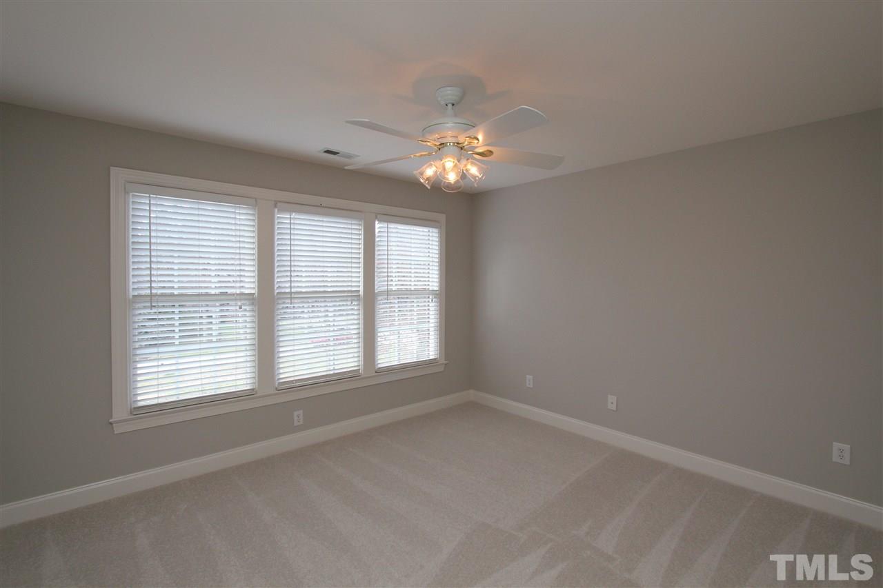 7121 Trenton Ridge Court Raleigh, NC 27613 - Photo 20 of 25 a view of an empty room with a window