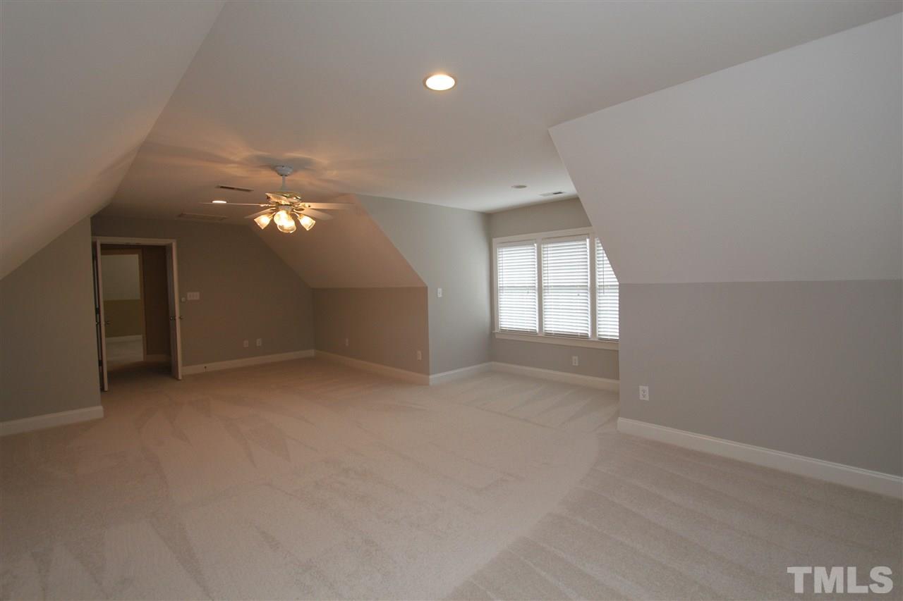 7121 Trenton Ridge Court Raleigh, NC 27613 - Photo 23 of 25 wooden floor in an empty room with a window
