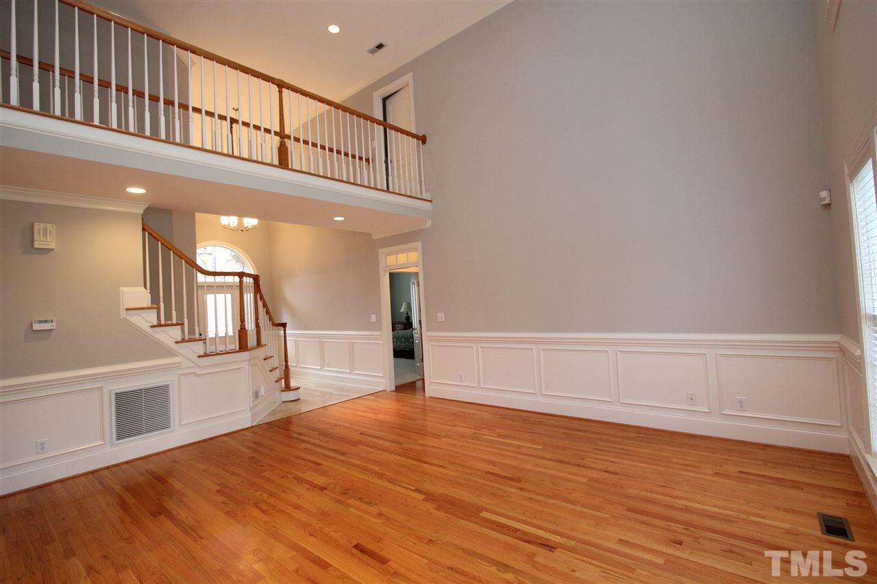 7121 Trenton Ridge Court Raleigh, NC 27613 - Photo 4 of 25 a view of empty room with wooden floor
