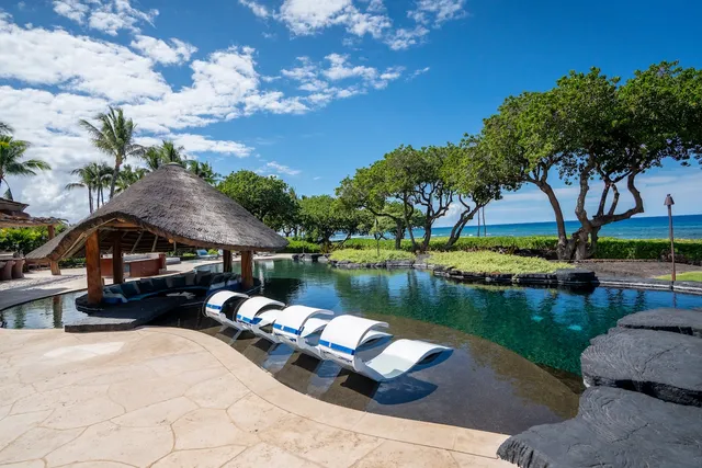a view of swimming pool with outdoor seating