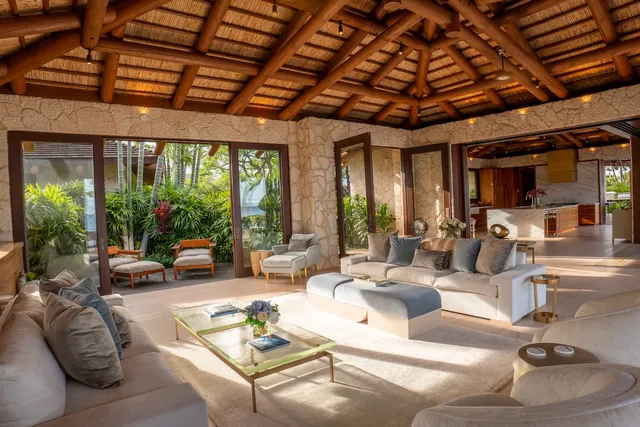 a large white kitchen with a large window