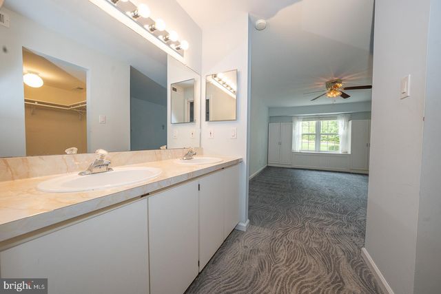 a en suite bathroom with a sink and a mirror