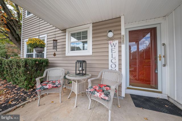 a backyard of a house with outdoor seating