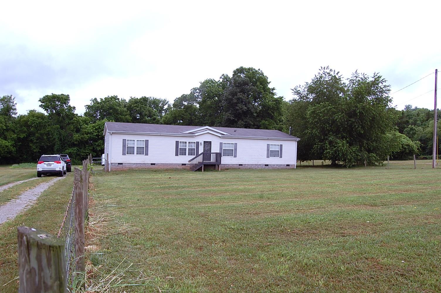 1773 Monsanto Road Columbia, TN 38401 - Photo 2 of 11 a view of a house with a yard and trees