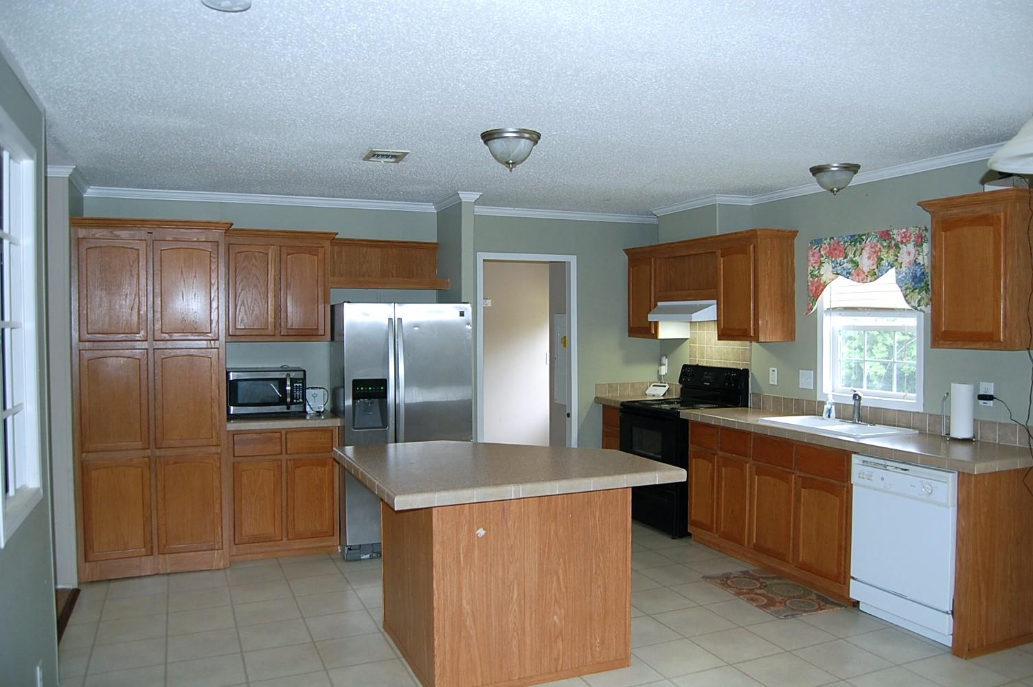 1773 Monsanto Road Columbia, TN 38401 - Photo 5 of 11 a large kitchen with a large counter top stainless steel appliances and cabinets
