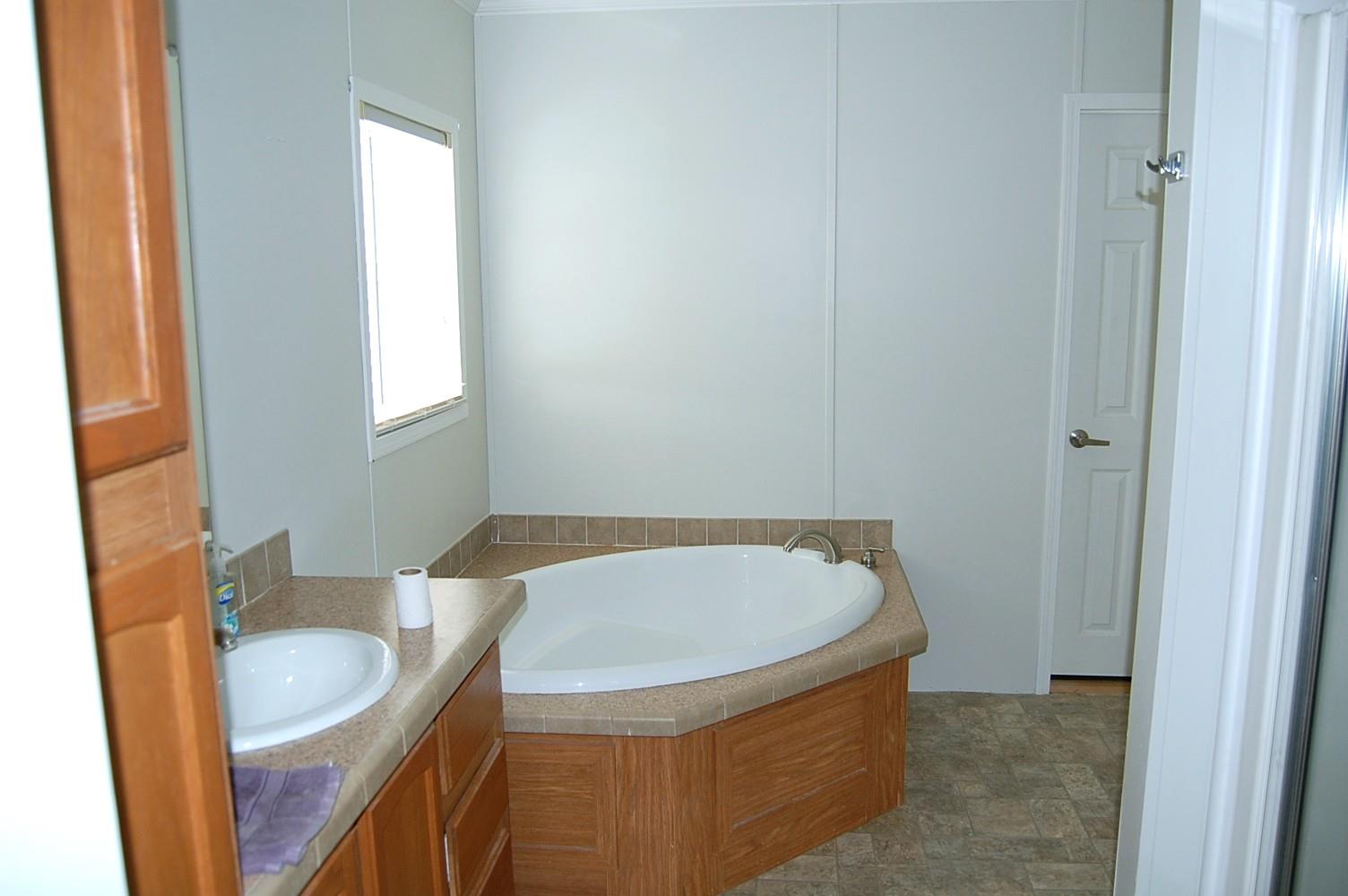 1773 Monsanto Road Columbia, TN 38401 - Photo 8 of 11 a bathroom with a tub and sink