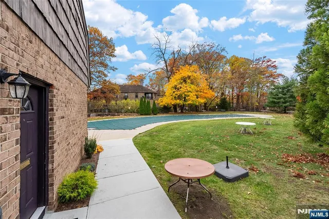 a view of a backyard with sitting area
