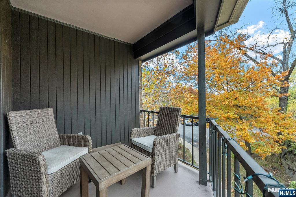 181 Long Hill Road, Unit 116 Little Falls, NJ 07424 - Photo 5 of 19 a view of a balcony with chairs