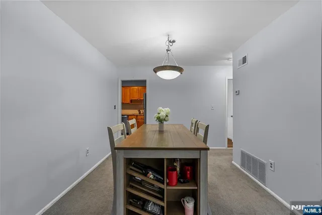 a dining room with a table and chairs