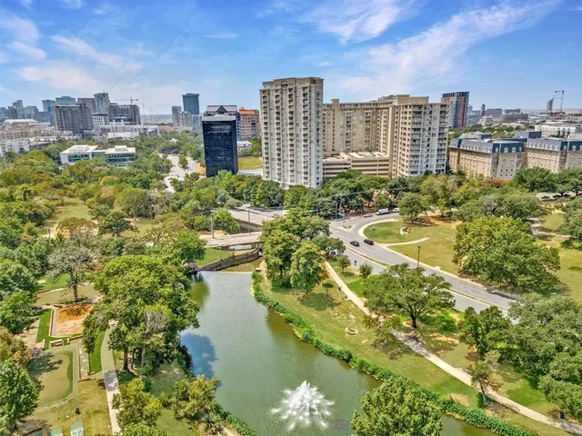 a view of a lake with a multi story building in front of it