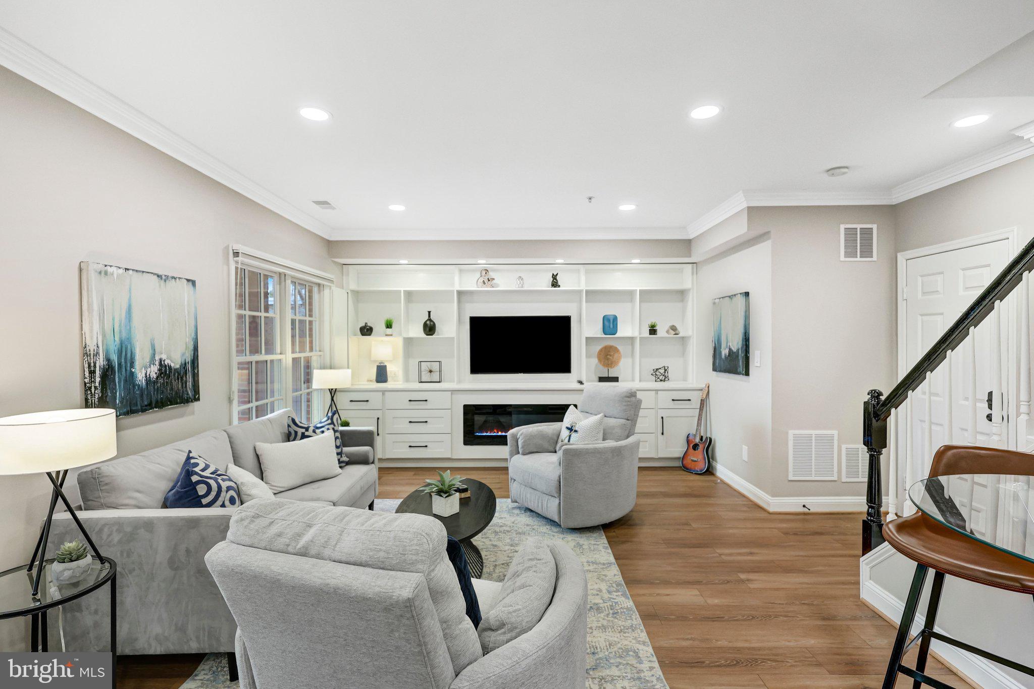 17 Alexander Street Alexandria, VA 22314 - Photo 22 of 49 a living room with furniture and a flat screen tv