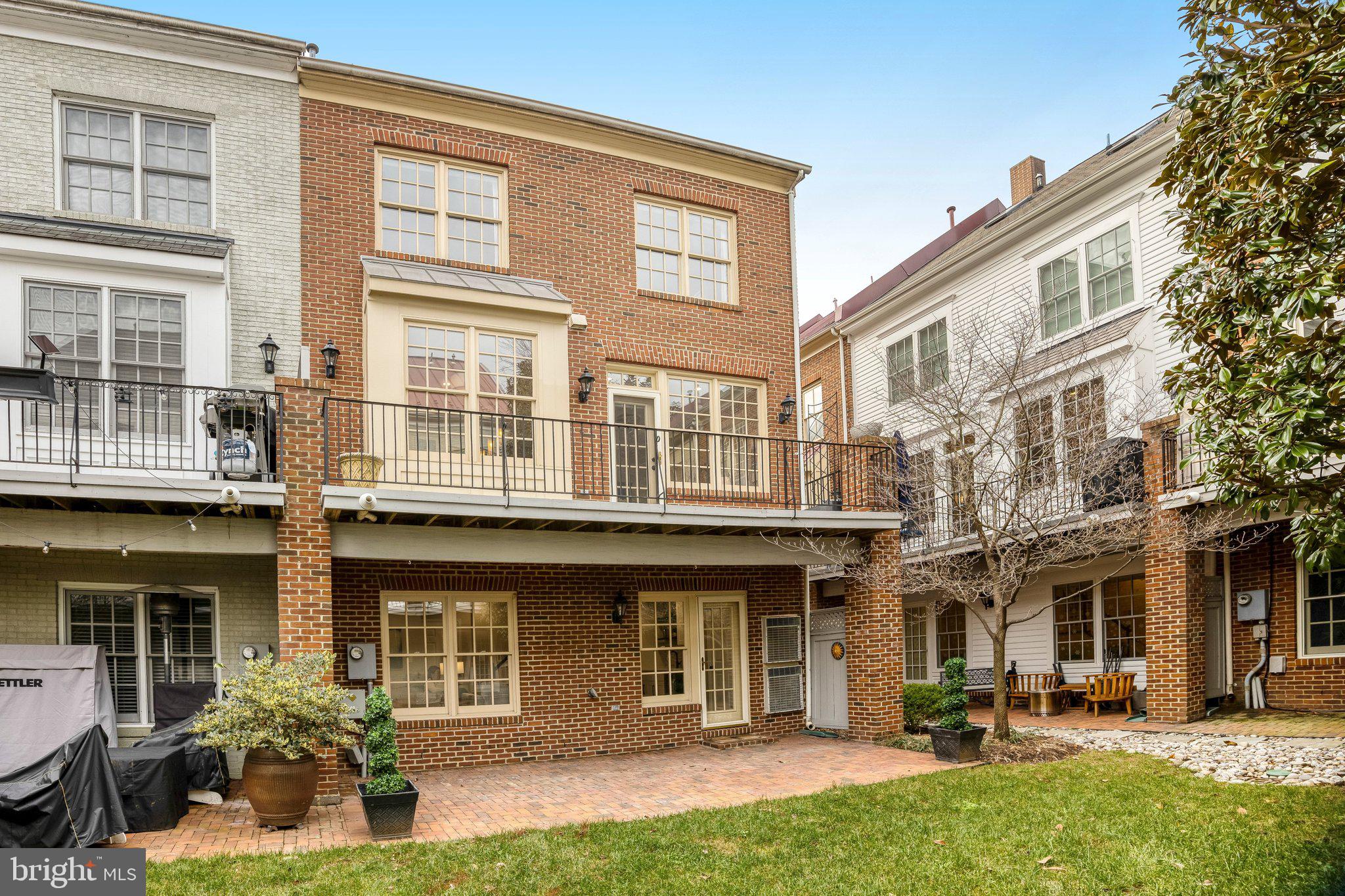 17 Alexander Street Alexandria, VA 22314 - Photo 25 of 49 a front view of a building with a yard