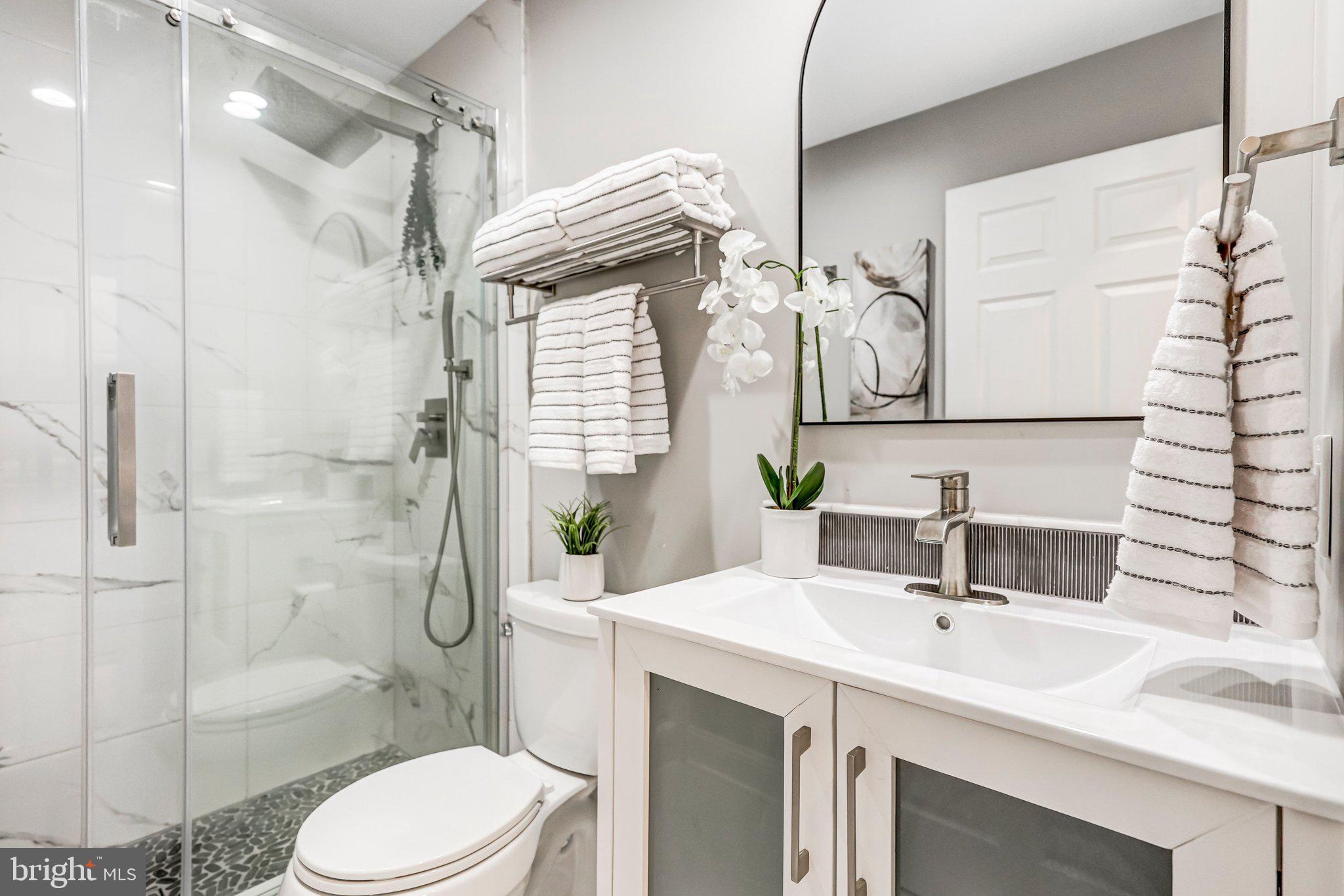 17 Alexander Street Alexandria, VA 22314 - Photo 30 of 49 a bathroom with a sink toilet and shower