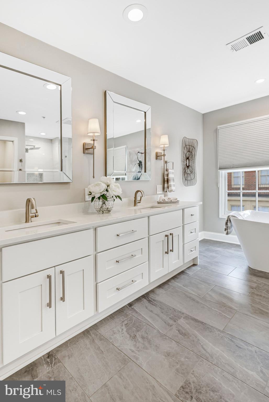 17 Alexander Street Alexandria, VA 22314 - Photo 35 of 49 a spacious bathroom with double sink large mirror and a window