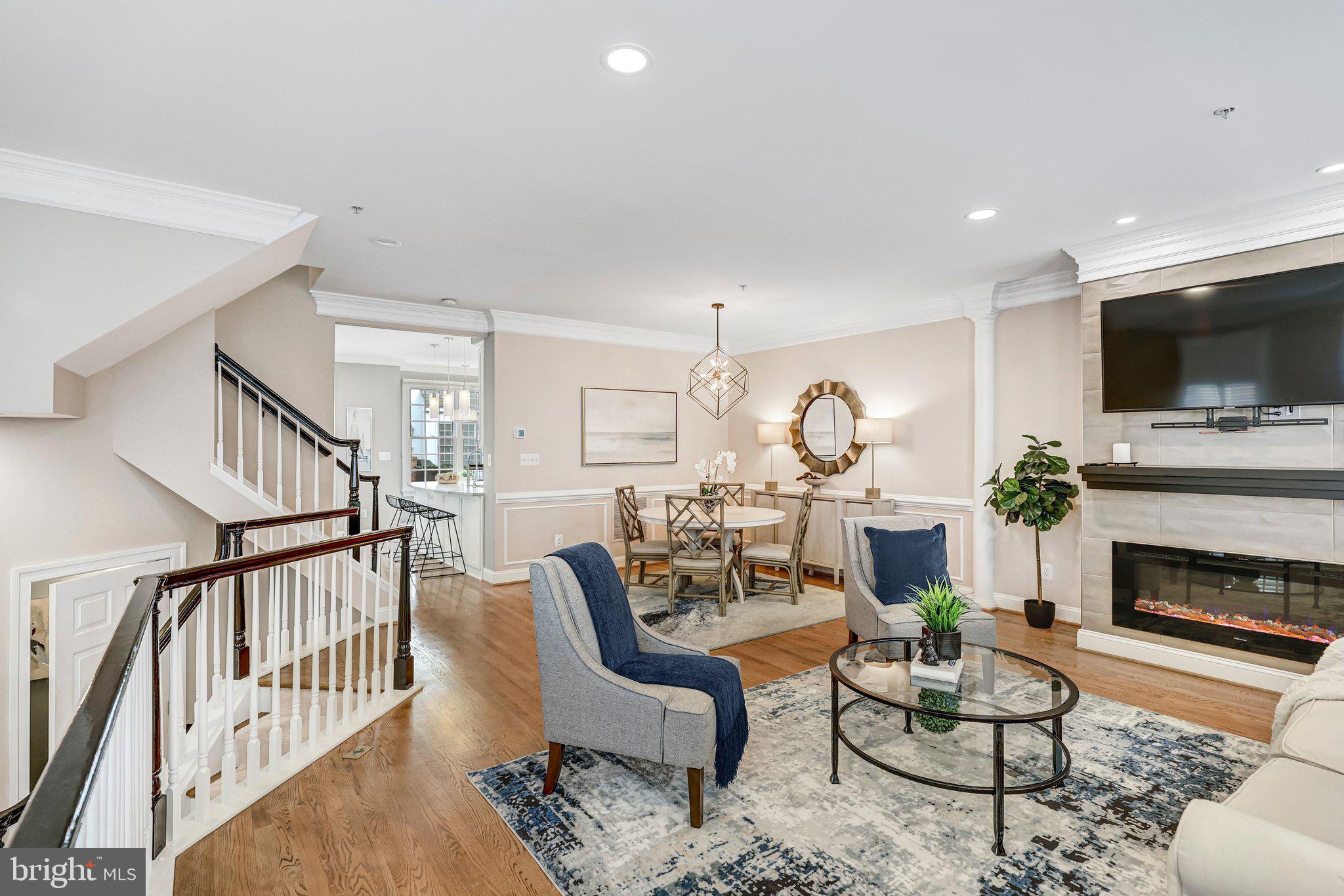 17 Alexander Street Alexandria, VA 22314 - Photo 6 of 49 a living room with furniture a fireplace and a flat screen tv