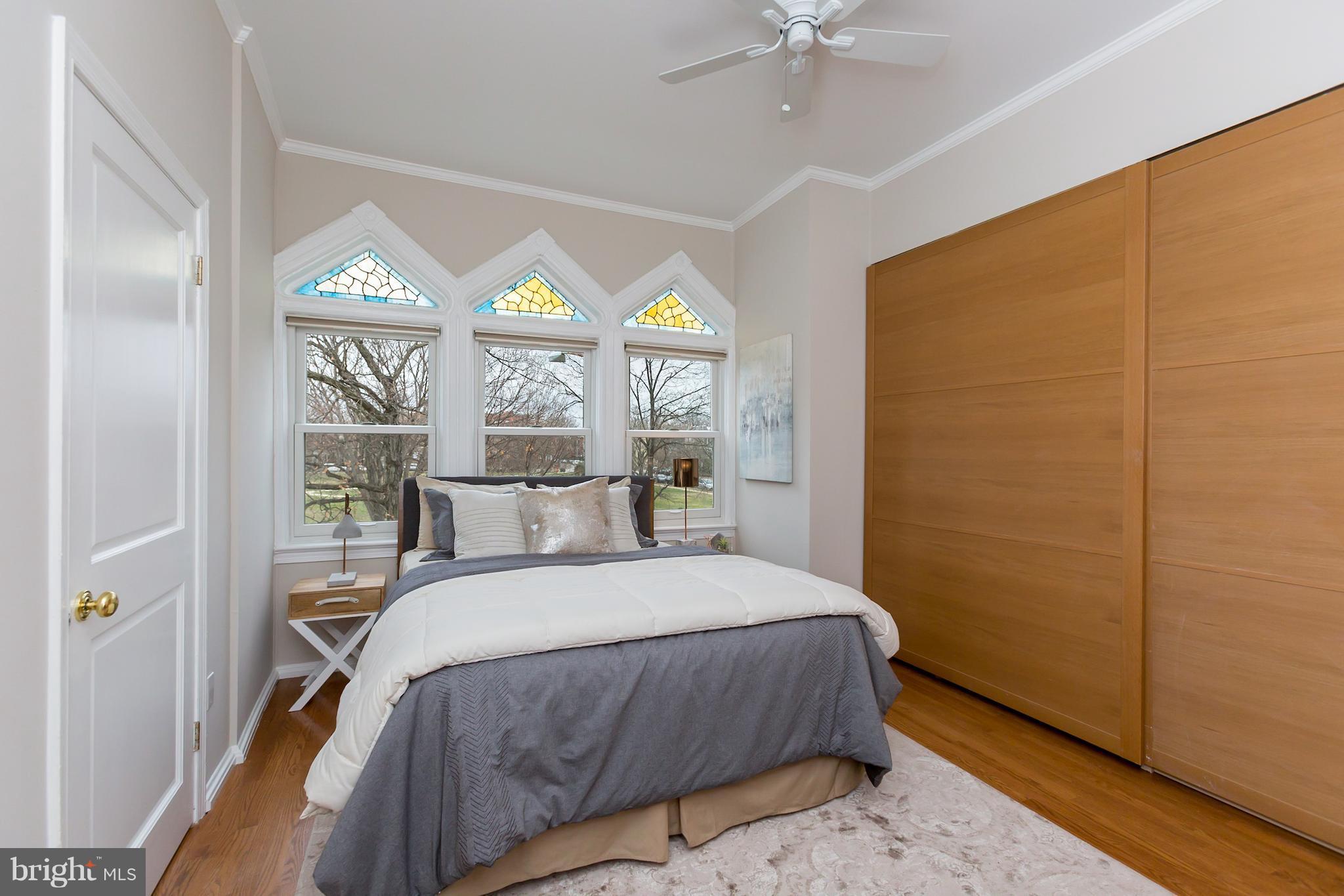 437 2nd Street Southeast, Unit 2B Washington, DC 20003 - Photo 11 of 20 a bedroom with a bed and a window