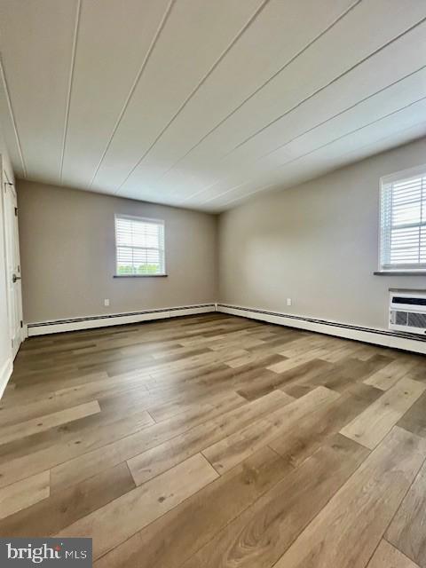 100 Windermere Avenue, Unit 204 Wayne, PA 19087 - Photo 7 of 8 an empty room with wooden floor and windows