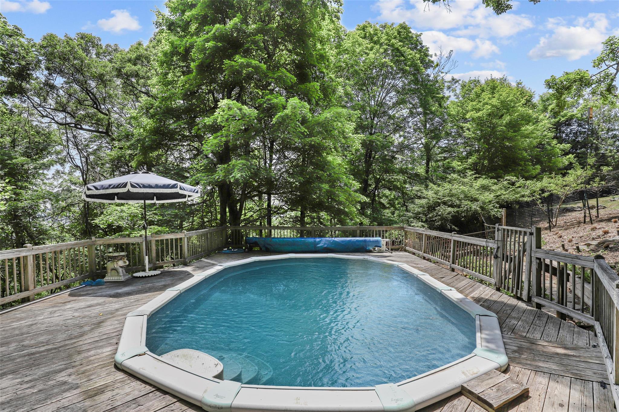 3841 Indian Hill Road Shrub Oak, NY 10588 - Photo 25 of 29 a view of a swimming pool with a patio