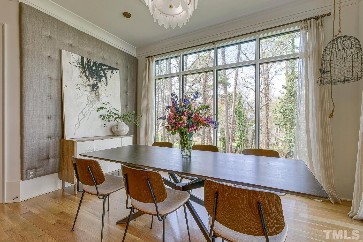 3521 Blue Ridge Road Raleigh, NC 27612 - Photo 27 of 100 a view of a dining room with furniture and wooden floor