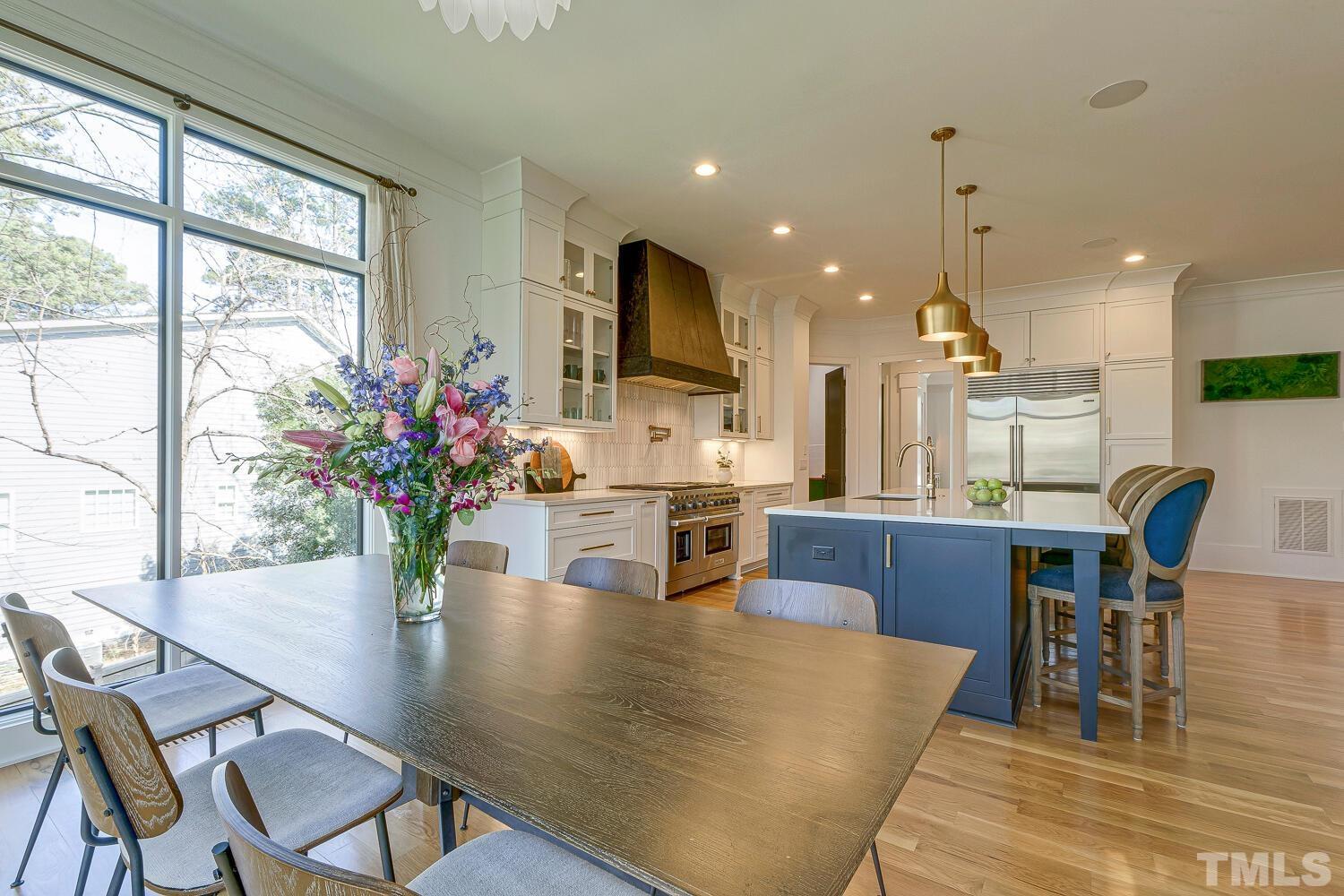 3521 Blue Ridge Road Raleigh, NC 27612 - Photo 29 of 100 a dining room with furniture and wooden floor