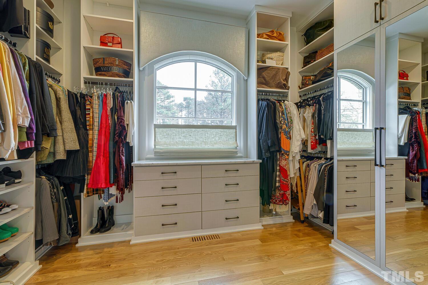 3521 Blue Ridge Road Raleigh, NC 27612 - Photo 47 of 100 a view of walk in closet with clothes and shoes