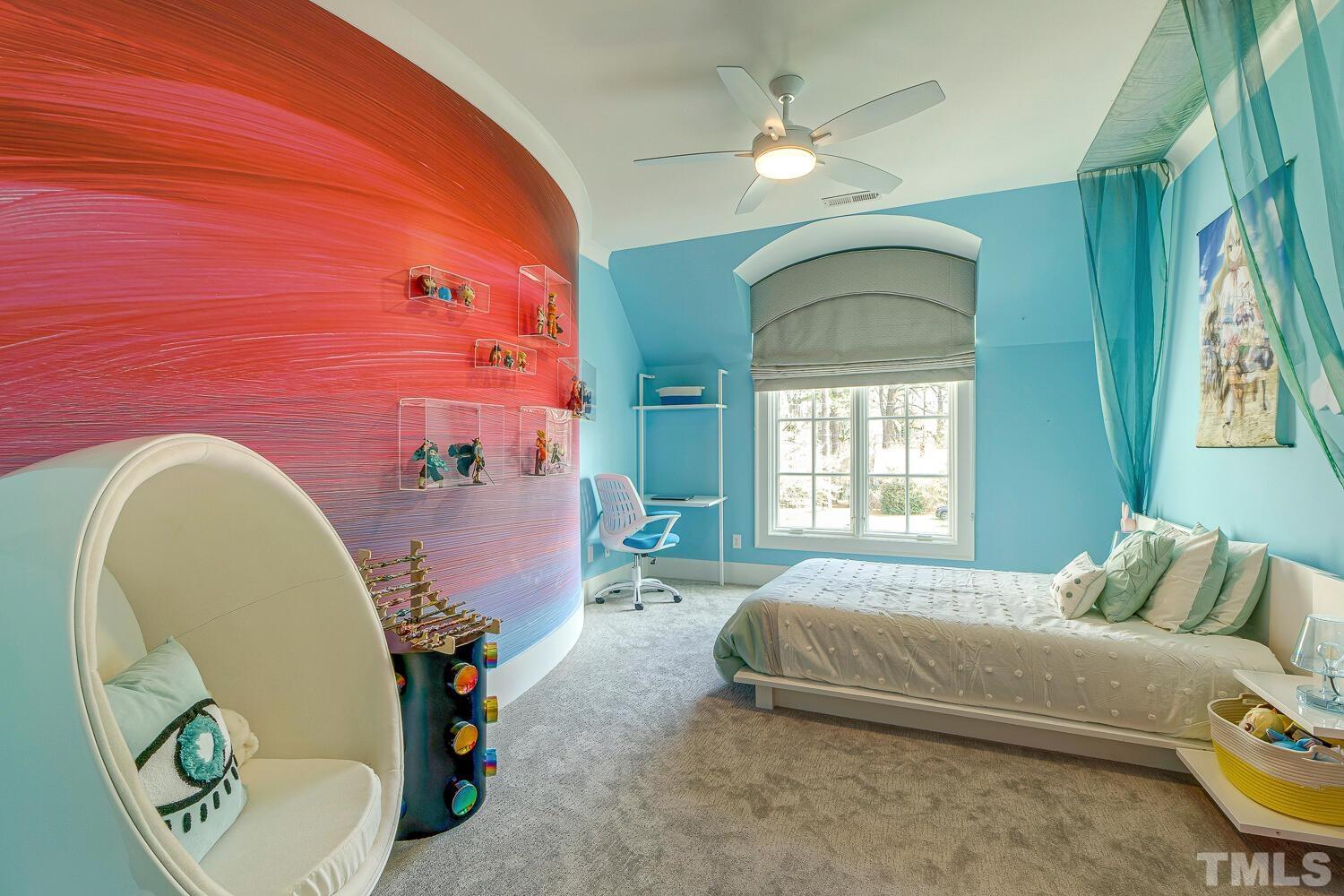 3521 Blue Ridge Road Raleigh, NC 27612 - Photo 52 of 100 a spacious bedroom with a bed and a chandelier