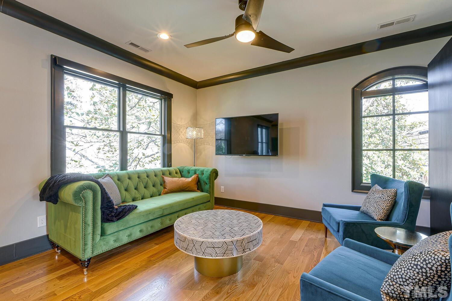 3521 Blue Ridge Road Raleigh, NC 27612 - Photo 62 of 100 a living room with furniture and a flat screen tv