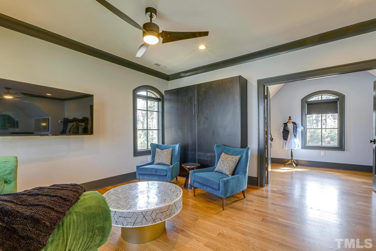 3521 Blue Ridge Road Raleigh, NC 27612 - Photo 63 of 100 a living room with furniture and a wooden floor