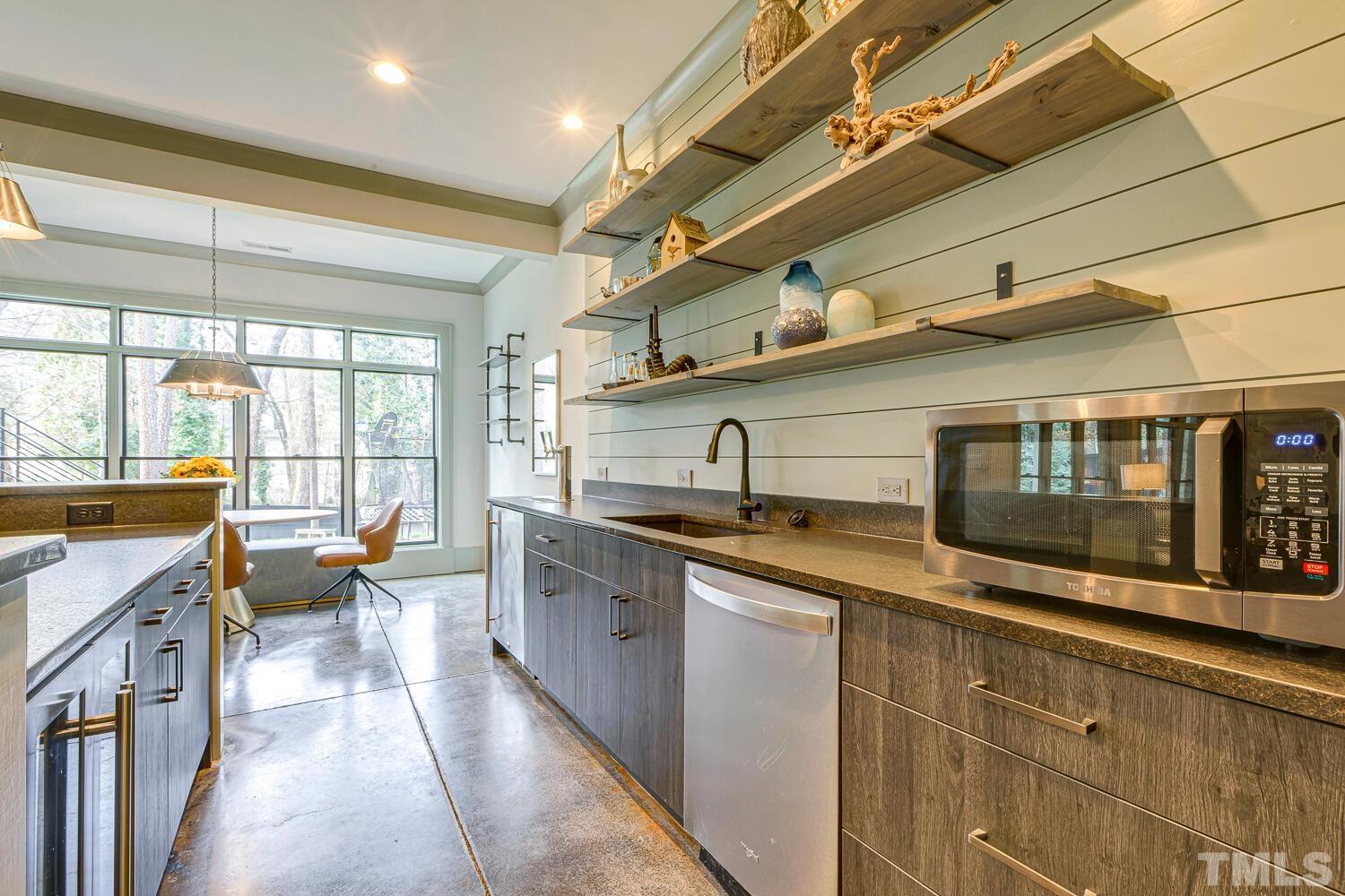 3521 Blue Ridge Road Raleigh, NC 27612 - Photo 74 of 100 a kitchen with stainless steel appliances granite countertop a sink and a stove
