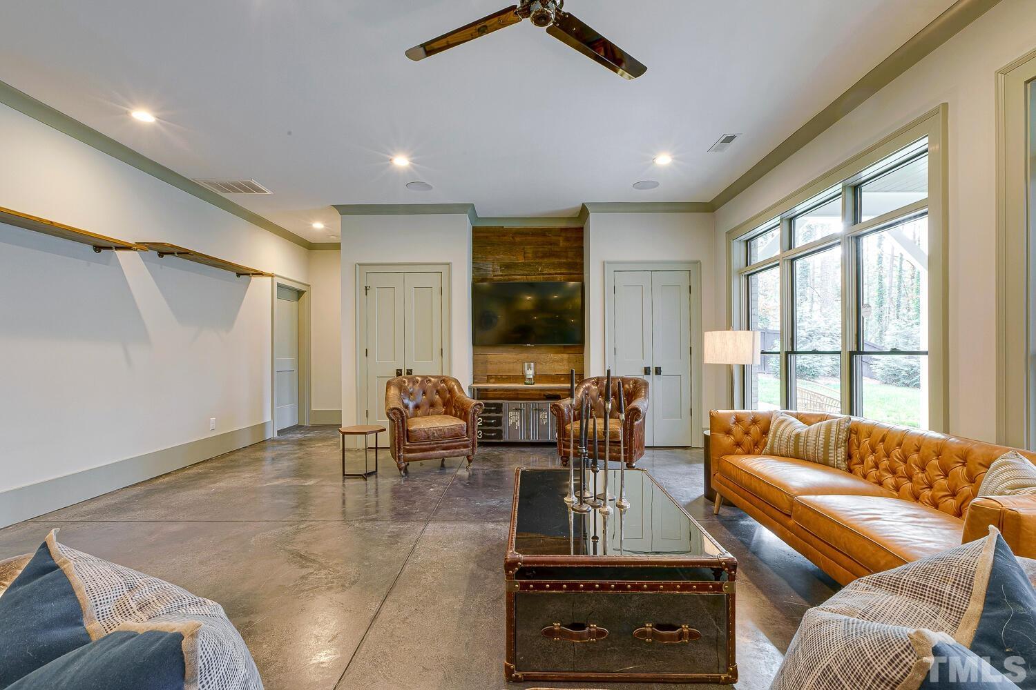 3521 Blue Ridge Road Raleigh, NC 27612 - Photo 77 of 100 a living room with furniture and large windows