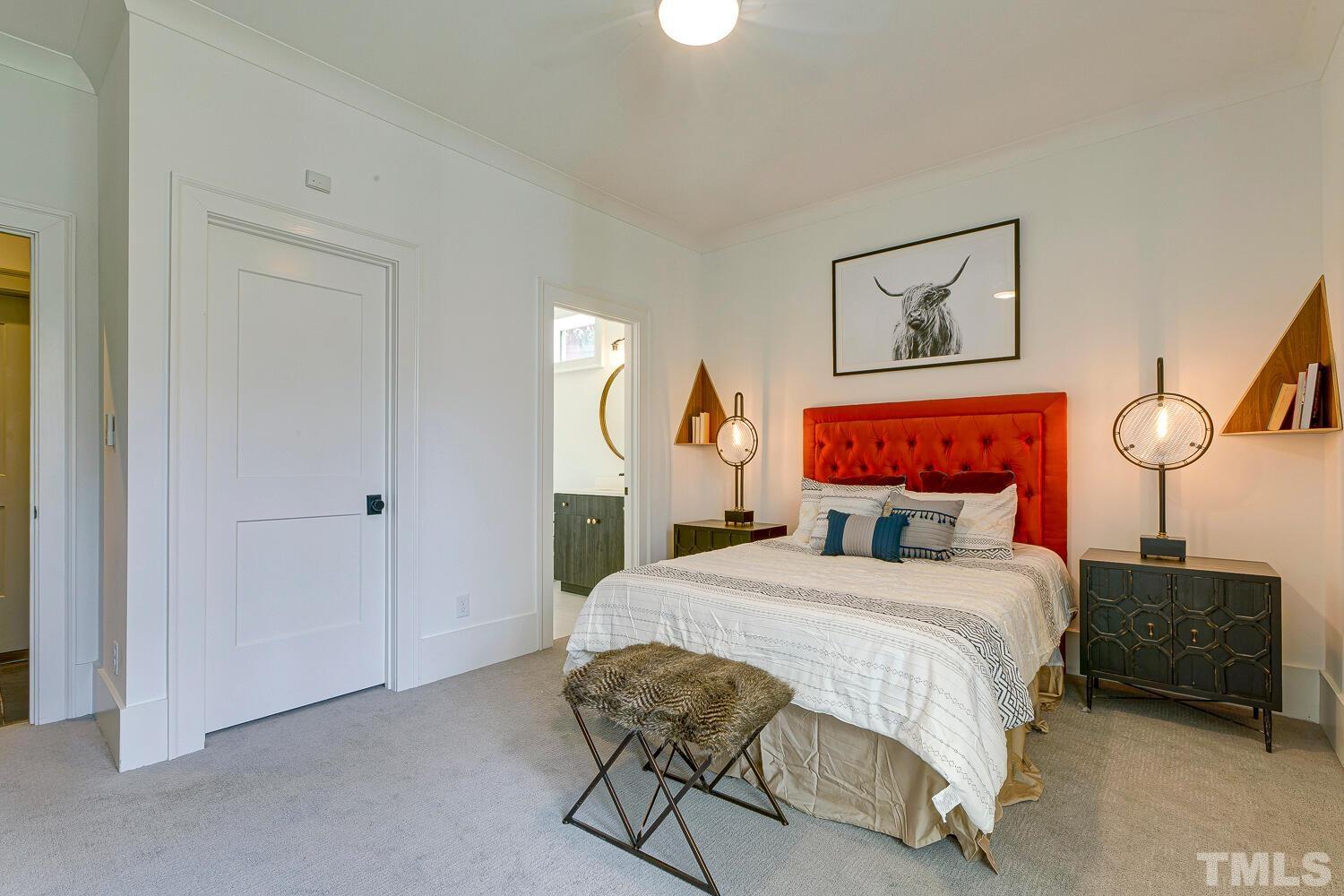 3521 Blue Ridge Road Raleigh, NC 27612 - Photo 81 of 100 a bedroom with a bed and a painting on the wall