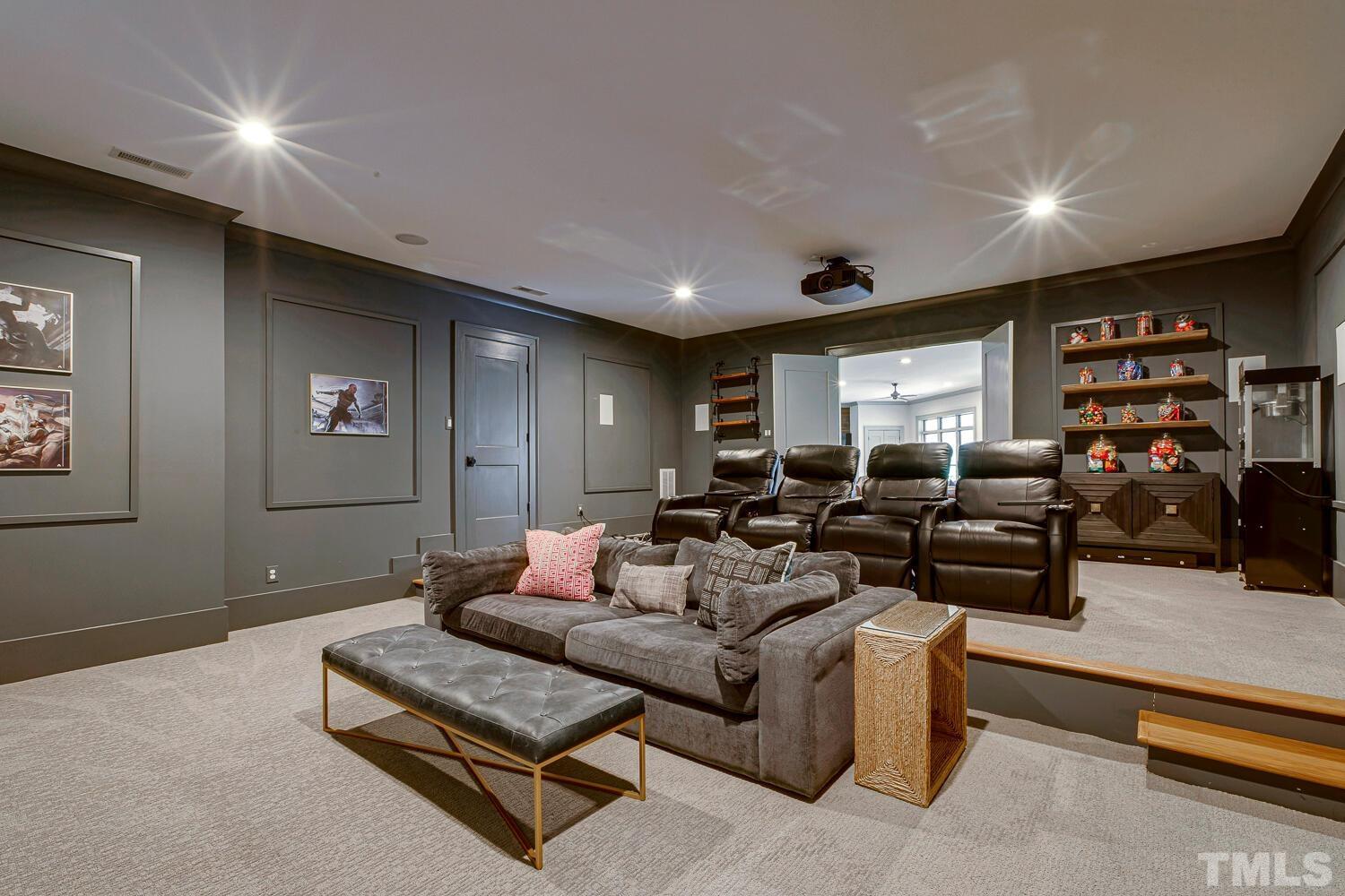 3521 Blue Ridge Road Raleigh, NC 27612 - Photo 84 of 100 a living room with furniture and a flat screen tv