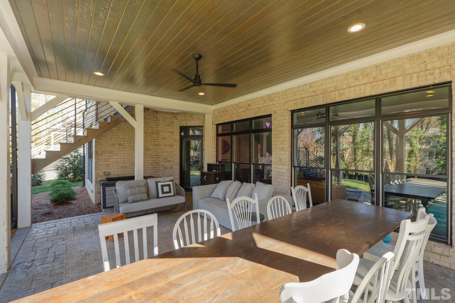 3521 Blue Ridge Road Raleigh, NC 27612 - Photo 86 of 100 a view of a dining room with furniture window and outside view
