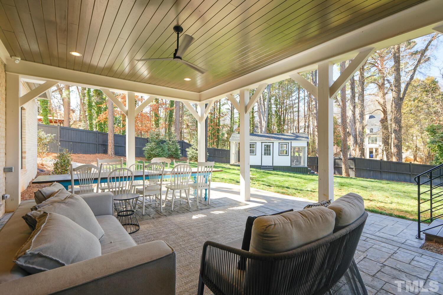 3521 Blue Ridge Road Raleigh, NC 27612 - Photo 88 of 100 a living room with furniture and floor to ceiling windows