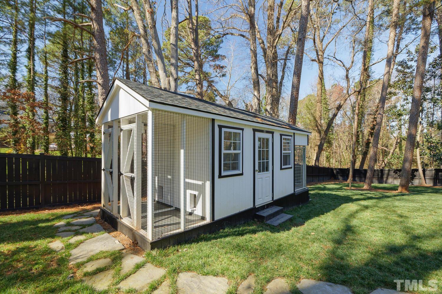 3521 Blue Ridge Road Raleigh, NC 27612 - Photo 93 of 100 a view of a house with a yard