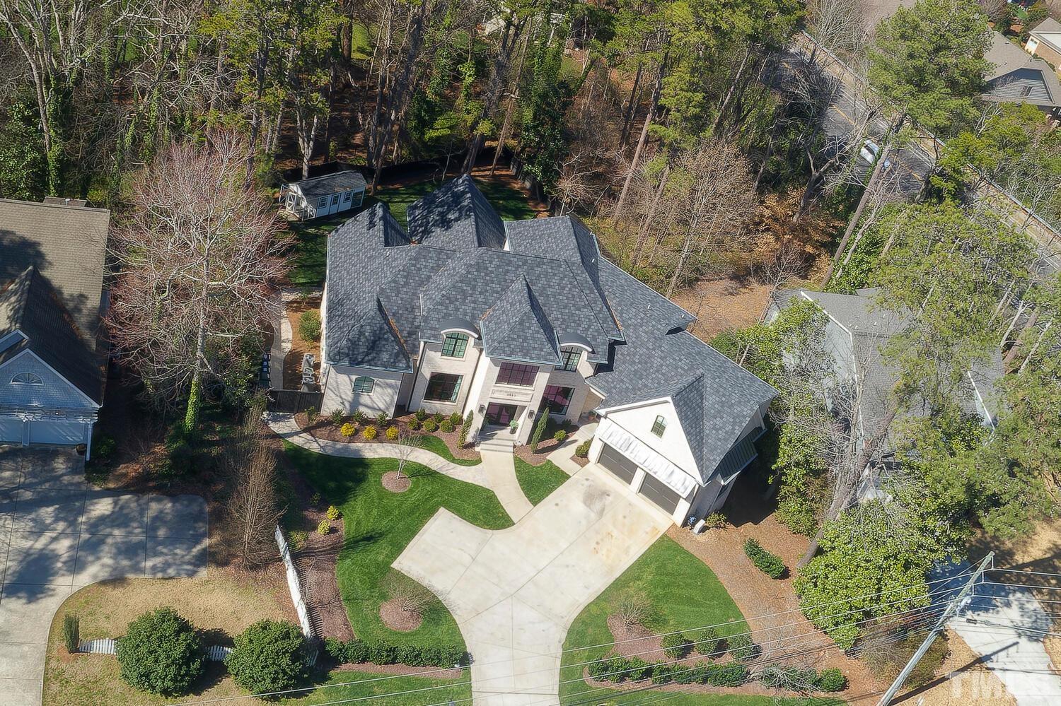 3521 Blue Ridge Road Raleigh, NC 27612 - Photo 96 of 100 an aerial view of a house with outdoor space