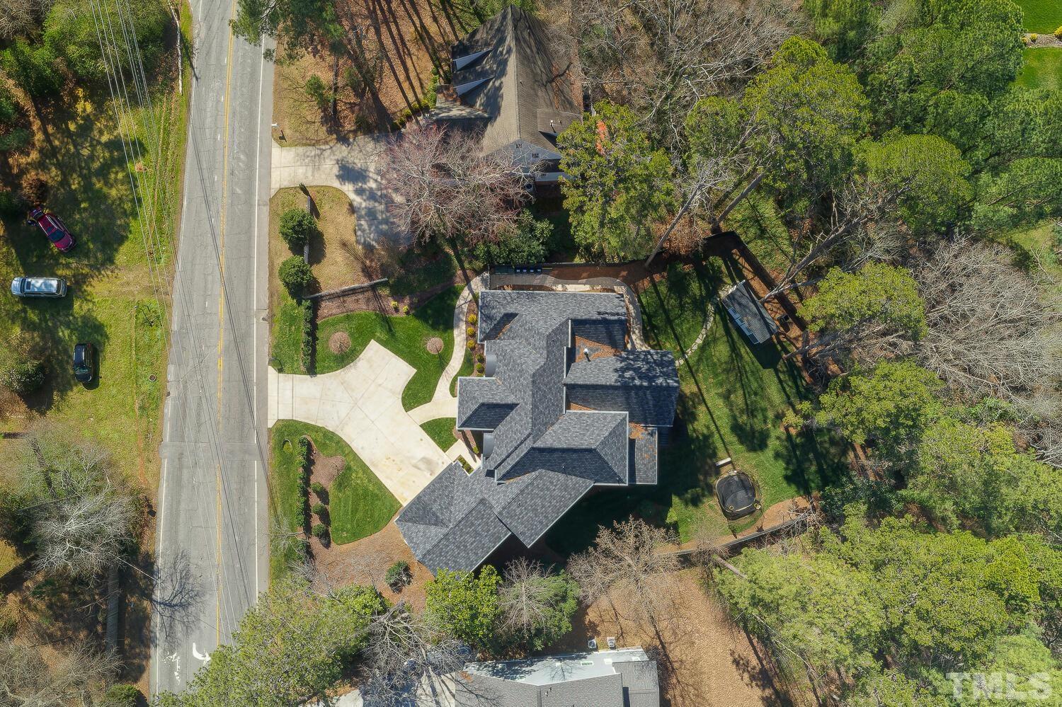 3521 Blue Ridge Road Raleigh, NC 27612 - Photo 98 of 100 an aerial view of a house with outdoor space