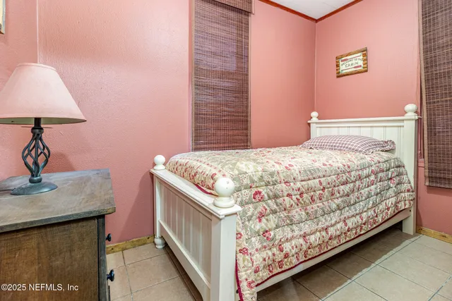 a bedroom with a bed and a table in it